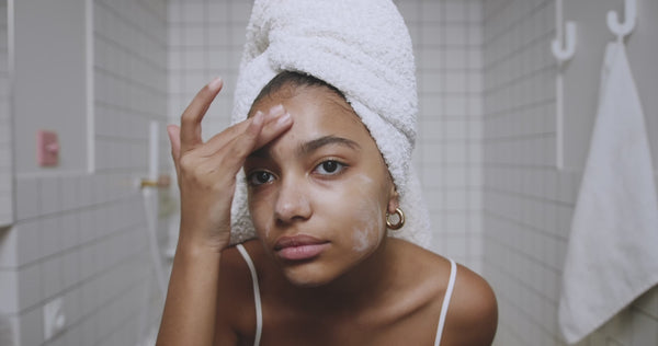 Applying cream to face